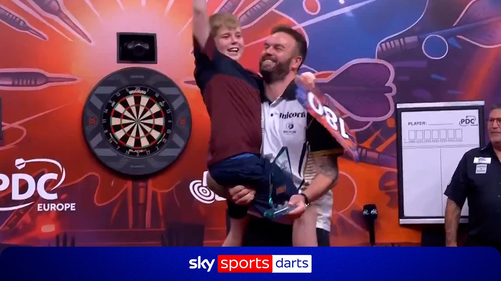 Ross Smith Celebrates Hungarian Darts Trophy Victory with Son