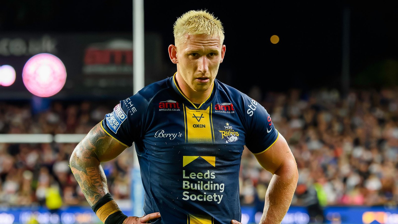 Wigan Dominates Leeds in Showdown of Champions and Challengers