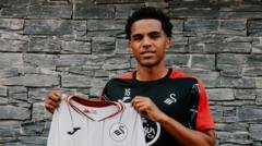 Swansea sign Huddersfield midfielder Iorpenda